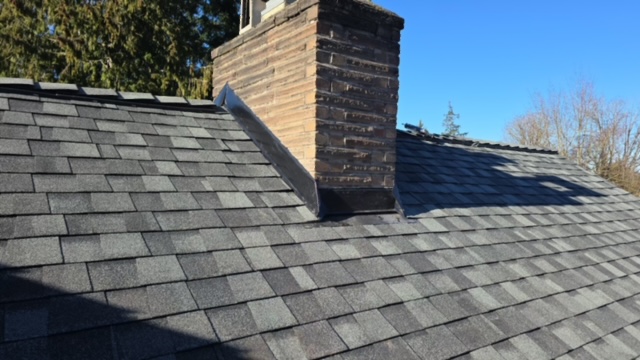 New counter flashing installed on a chimney