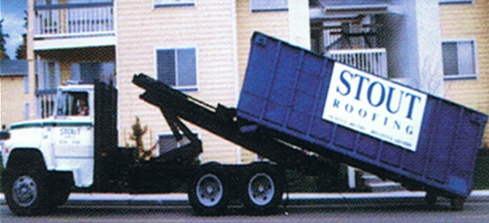Roofing crew working together on a residential roof installation
